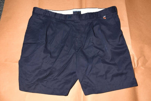 A pair of Telstra-issued work shorts used by the prosecution to illustrate the type of shorts Mr Edwards allegedly wore around 1996 and 1997. They are important to the state's case as fibres allegedly matching Telstra work uniform material were found on Ciara and Jane's bodies. The shorts were given to police by Jeffrey Cohen as an example. 
