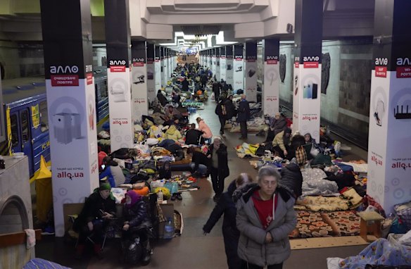 People with their belongings hide in a city subway that they have used as a bomb shelter for more than three weeks in Kharkiv, Ukraine.