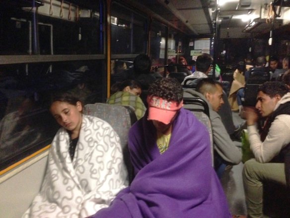 Migrants board buses said to be bound for Austria outside Keleti station in central Budapest, Hungary.