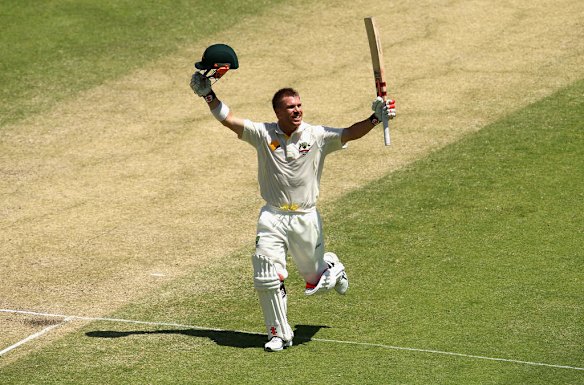 David Warner of Australia celebrates after reaching his century.