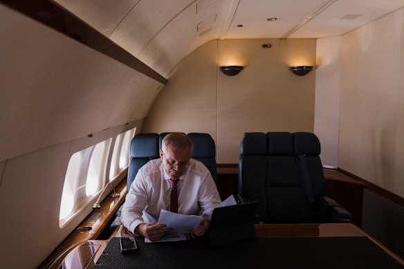 The Prime Minister, en route to Brisbane from Sydney, views himself as a problem-solver and pragmatist  - "a bit of a bulldozer", he says. 