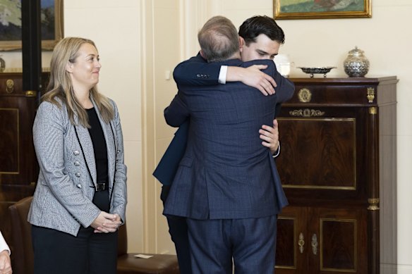 Prime Minister Anthony Albanese is congratulated by his son Nathan and partner Jodie Haydon.