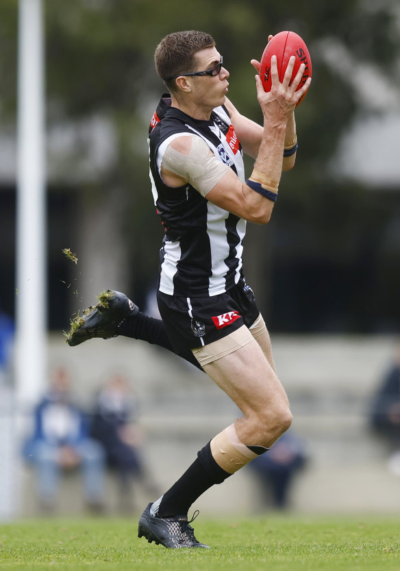 Mason Cox on the move at training.