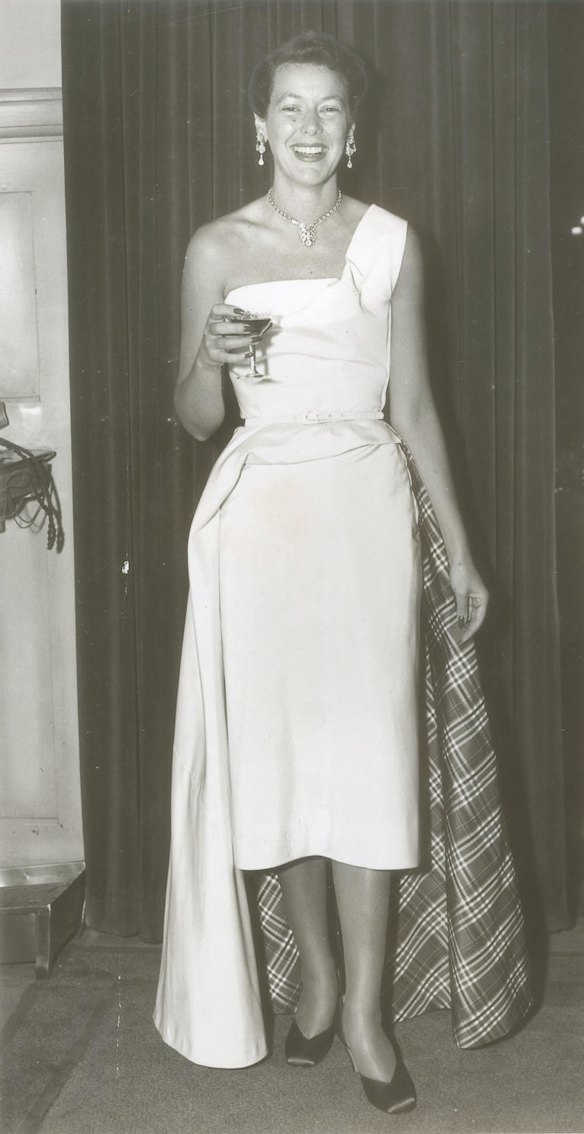 Socialite Sheila Scotter in her young days with glass of champagne.