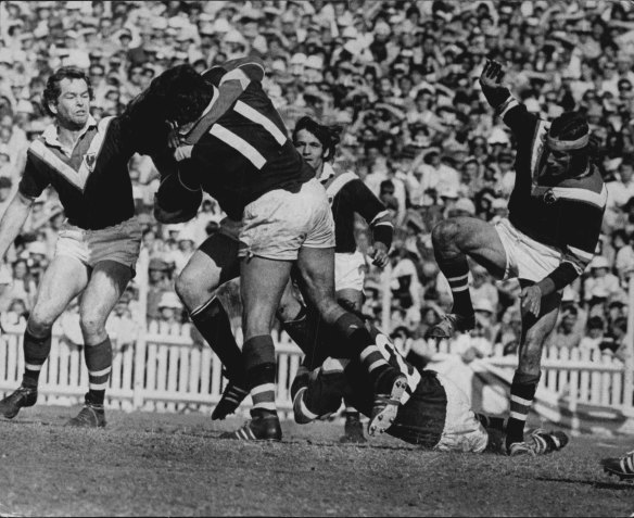 “This picture shows the intensity of the rugby league final at the SCG yesterday between Eastern Suburbs and Manly. The big fellow carrying the No. 11 guernsey is East’s Artie Beetson.” September 16, 1972. 