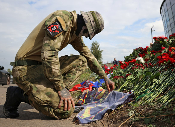A fighter of the Wagner private mercenary group visits a makeshift memorial in Saint Petersburg, Russia.