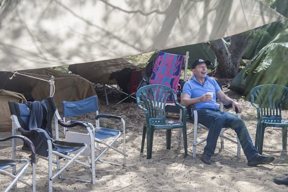 Prime Minister Tony Abbott relaxes at the ranger campat the mouth of the Jardine River near Bamaga at the tip of Cape York on Friday 28 August 2015.