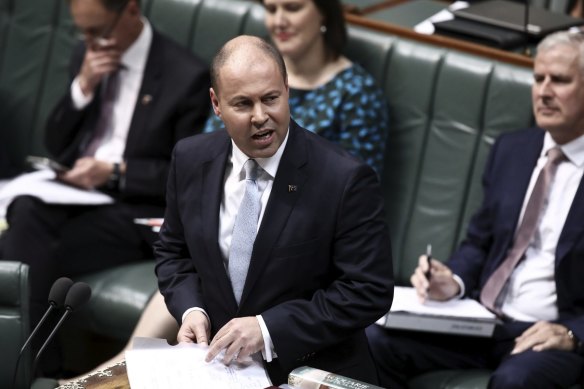 Josh Frydenberg handing down the 2019-20 budget in April last year, predicting the first surplus in a decade. New figures show the budget in its largest deficit on record.