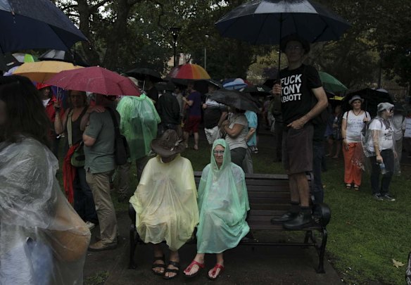 Australians fed up with the Abbott Governments policies turned out in their thousands to have their voices heard on issues from Climate Change, education, forest management and Assylum Seekers. Attending the 20,000 strong rally in Sydney was British Folk/Protest singer songwriter was Billy Bragg.Photograph by Dean Sewell.S.M.H.News.Taken Sunday 16th March 2014.   das140316.001.011.send.jpg