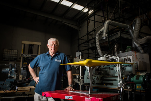 Underwater inventor Ron Allum with a model of the Sun Ray glider.