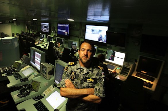 Lieutenant Adam Simeoni in the ship's operations room.