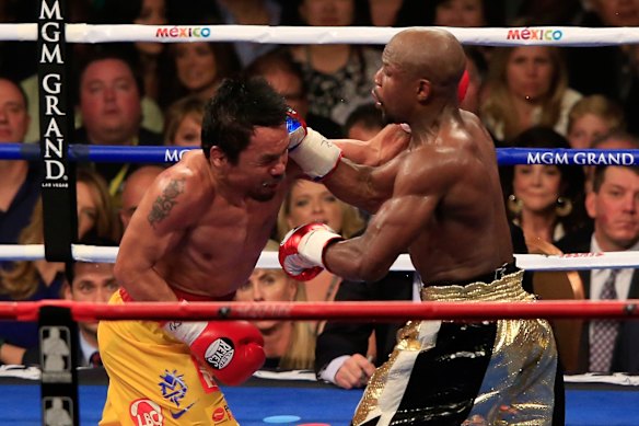 Floyd throws a right at Manny .