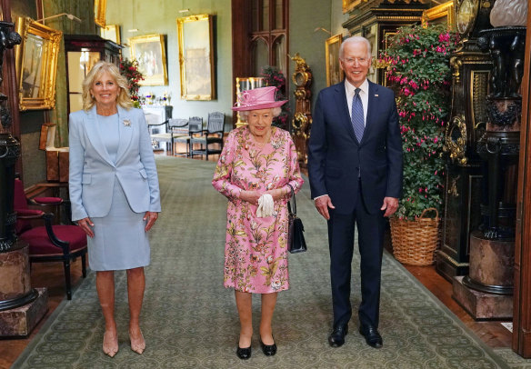 Queen Elizabeth II with US President Joe Biden and First Lady Jill Biden in the Grand Corridor during their visit to Windsor Castle on June 11, 2021.