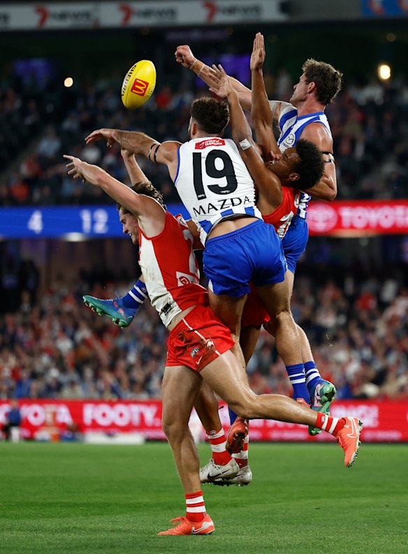 Hayden McLean, Griffin Logue, Joel Amartey and Charlie Comben compete for the ball.