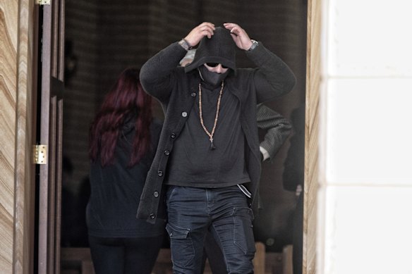 A man leaves the church during Lametta Fadlallah's funeral.