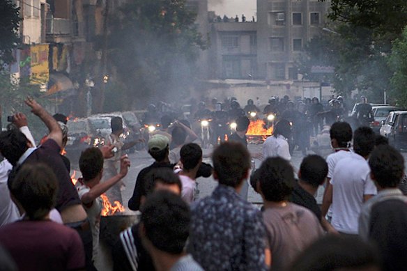 In this photograph posted on the internet, protesters clash with riot police at an anti-government protest in Tehran, Iran on Saturday June 20, 2009.