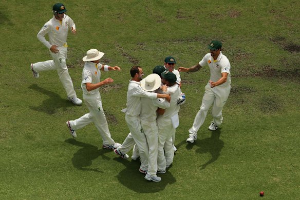 The Australia team celebrate after Nathan Lyon and Brad Haddin of Australia combined to remove Ben Stokes of England during day five of the Third Ashes Test Match.