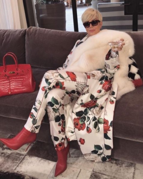 Kris Jenner is the latest in the family to change up her hair by dyeing her black pixie cut an icy blonde hue, and Kim Kardashian marked the transformation on Instagram by writing, "caption this." Her suggestion was "SWF", or "Single White Female".  Jenner is pictured with all her favourite things: lounging on a couch, wearing a matching silk floral pant and jacket ensemble with a white fur stole, red alligator Birkin bag, sunglasses, and, of course, a martini. 