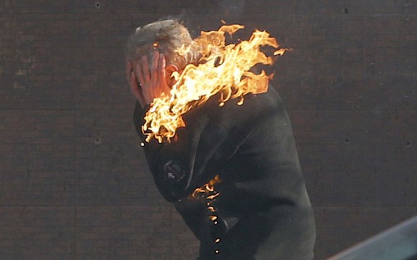 An anti-government protester is engulfed in flames during clashes with riot police outside Ukraine's parliament in Kiev, Ukraine, Tuesday, Feb. 18, 2014. Thousands of angry anti-government protesters clashed with police in a new eruption of violence following new maneuvering by Russia and the European Union to gain influence over this former Soviet republic.