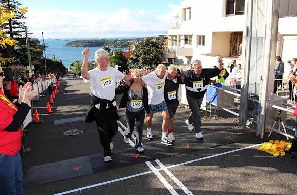 The Humpty Dumpty Foundation's Balmoral Burn run. Competitors in the Male/female aged 50-59 make their way to the finish line.
