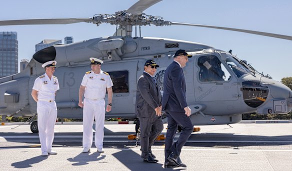 Indonesian President Prabowo Subianto and Prime Minister Anthony Albanese on the flight deck of HMAS Canberra in Sydney,