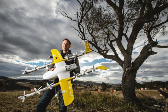 Wing chief executive James Ryan Burgess, pictured above, with one of the household delivery drones