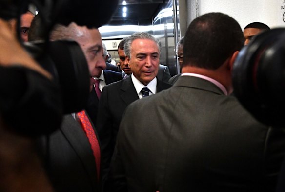 Booed at the opening and closing ceremonies and now under investigation for corruption: President Michel Temer.
