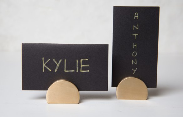 Name Game: Assigned seating is a good thing at thing at a dinner party. Direct funny people to the middle of the table and shy ones near the host. Switch it up for dessert so you can mix up the dynamic. Brass card holders, $29.95. kikki-k.com