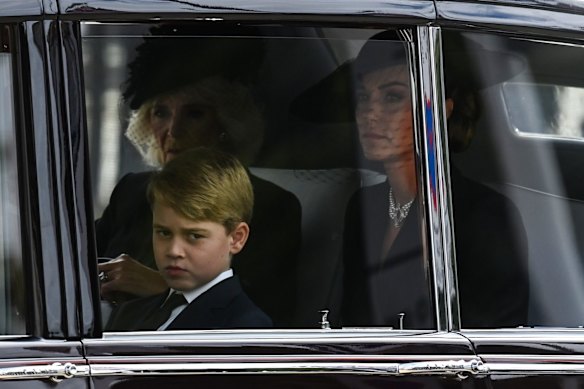 Camilla, Queen Consort, Catherine, Princess of Wales and Prince George of Wales in the procession behind the coffin of Queen Elizabeth II, travelling from Westminster Abbey to Wellington Arch after the State Funeral.