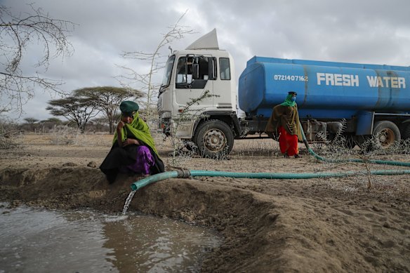 Rangers from the Sabuli Wildlife Conservancy supply water from a tanker for wild animals in the conservancy in Wajir County, Kenya.