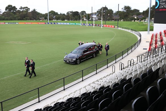 Shane Warne's children Brooke, Jackson and Summer, his parents Keith and Brigitte and brother Jason accompany his coffin on a lap of honour around the St Kilda Football Club at his private funeral. 