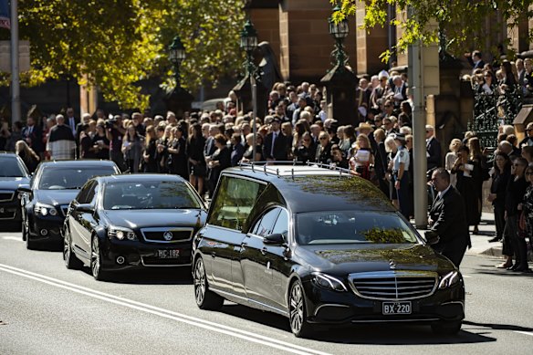 Family and friends gather after the state funeral of fashion designer Carla Zampatti AC at St Mary's Cathedral. 