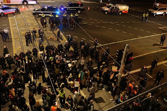 The black lives matter march in Sydney as night falls.
