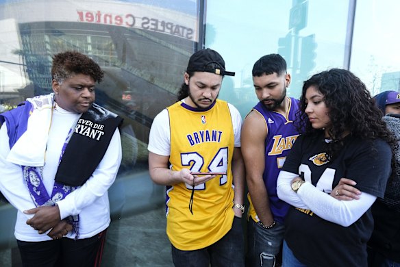 Fans watch the live stream of the celebration of life public memorial for Kobe Bryant and his daughter, Gianna.