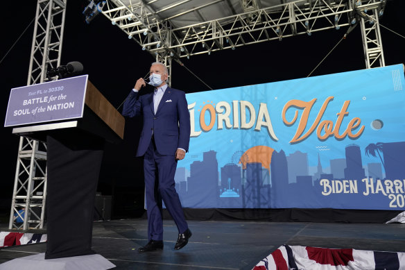 Democratic presidential candidate Joe Biden arrives to speak at a drive-in rally at the Florida State Fairgrounds.