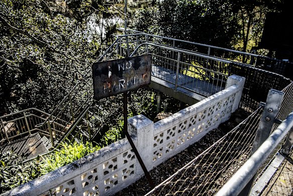 The Boundary is described as a guardrail, fence or wall whose purpose is not immediately clear, such as this old fence with useless signage at Old Coal Loader, Waverton.