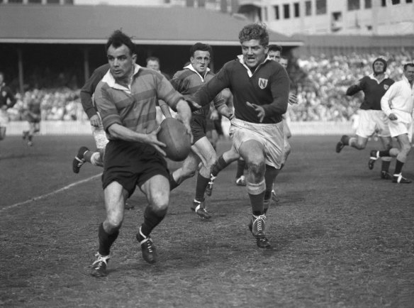 
South Sydney player Clive Churchill with the ball during the 1954 Rugby League Grand Final against the Newtown Jets at the Sydney Cricket Ground, 18 September 1954. 