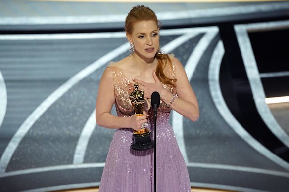 Jessica Chastain accepts the award for best performance by an actress in a leading role for "The Eyes of Tammy Faye".