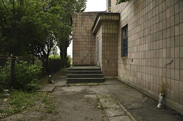 Flowers mark the location at an office building at 144 Yablunska Street, Bucha, where Russian paratroopers executed a group of eight men on March 4.