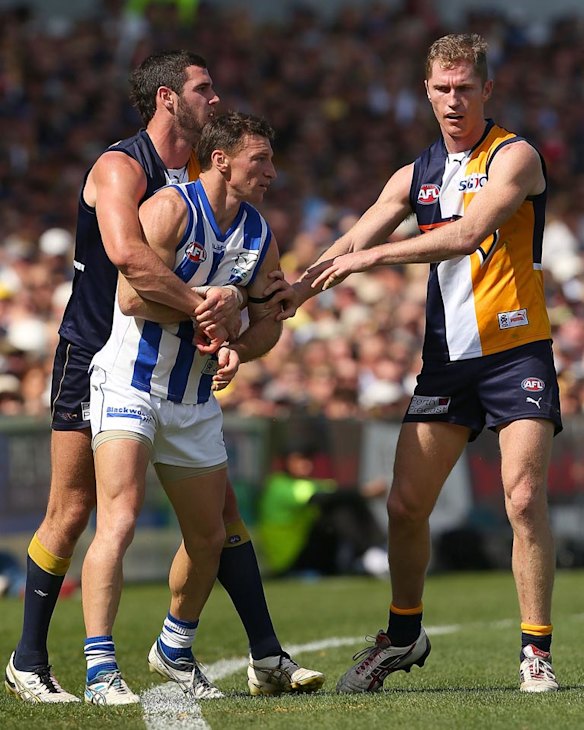 Eagles Jack Darling and Adam Selwood remonstrate with Brent Harvey.