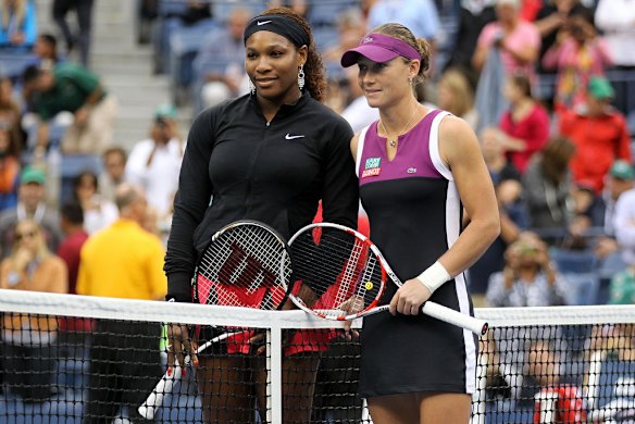 Samantha Stosur (right) of Australia and Serena Williams of the United States pose at the net before the women's singles final at the 2011 US Open.