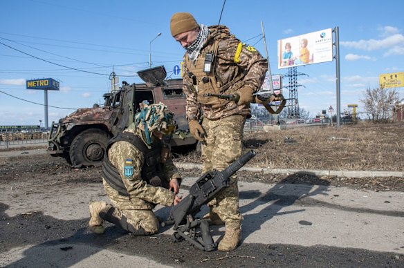 Ukrainian soldiers in Kharkiv on Sunday. Ukrainian authorities claimed that local forces had reclaimed the city from Russian troops.