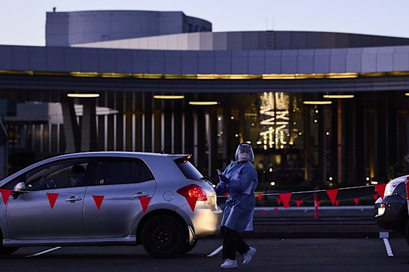 A medical worker is seen at the new 24-hour drive-through COVID-19 testing clinic at the Mounties Club car park in Mount Pritchard. New rules dictating that essential workers from the Fairfield LGA must be tested every three days if they are leaving the area come into force today. 17 July, 2021.

