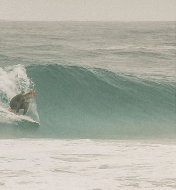 Tom Walker surfing off a Perth beach. 