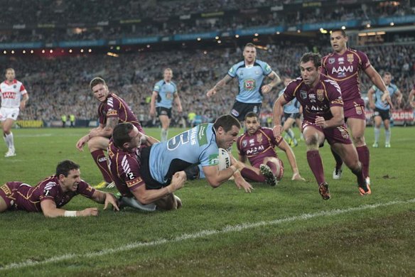 Blues winger James McManus scores a try.