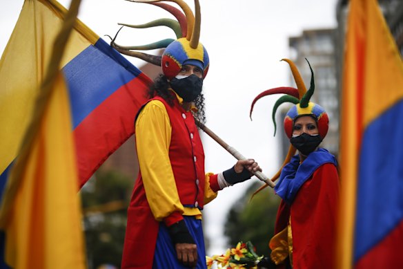 People decked out in national colors take part in an anti-government protest in Bogota, Colombia, as the county marks its Independence Day. 