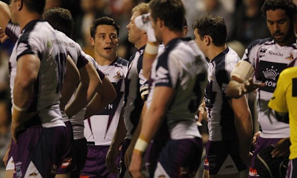Storms Cooper Cronk with his team mates.