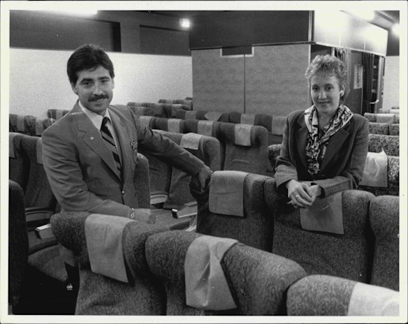 Qantas husband and wife flight attendants Nello and Camille Valvo in the Boeing 747 cabin mock-up training module at the cabin crew section of the Qantas Jet Base in 1986 during safety training.