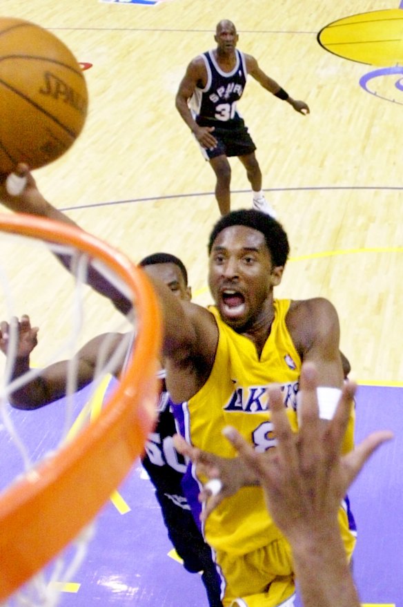 2001: Los Angeles Lakers' Kobe Bryant takes it to the hoop against the San Antonio Spurs in Los Angeles. 