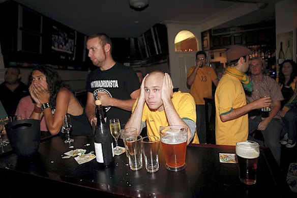 Soccer fans in Sydney show their disappointment.